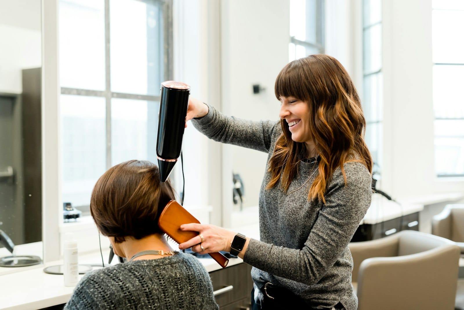 Stylist working on a client's hair